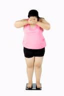 Woman on weighing scale