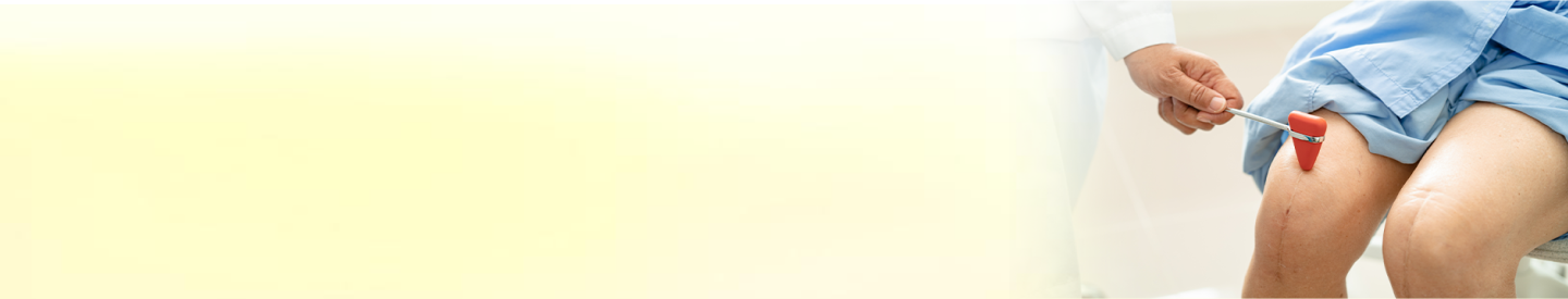 Doctor examining knee model