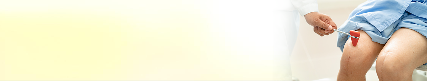 Doctor examining knee model